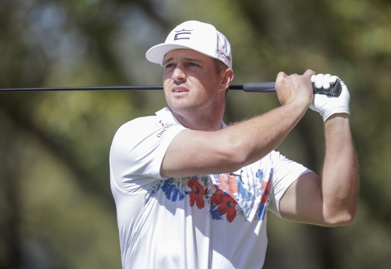 Mar 23, 2022; Austin, Texas, USA; Bryson DeChambeau tees off on #8 during the first round of the World Golf Championships-Dell Technologies Match Play golf tournament. Mandatory Credit: Erich Schlegel-USA TODAY Sports