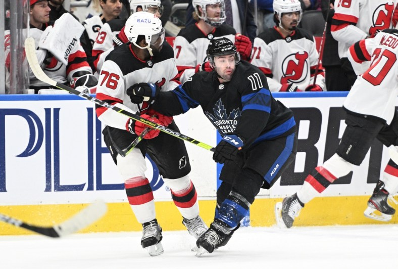 Mar 23, 2022; Toronto, Ontario, CAN; Toronto Maple Leafs forward Colin Blackwell (11) battles for position with New Jersey Devils defenseman P.K. Subban (76) in the first period at Scotiabank Arena. Mandatory Credit: Dan Hamilton-USA TODAY Sports