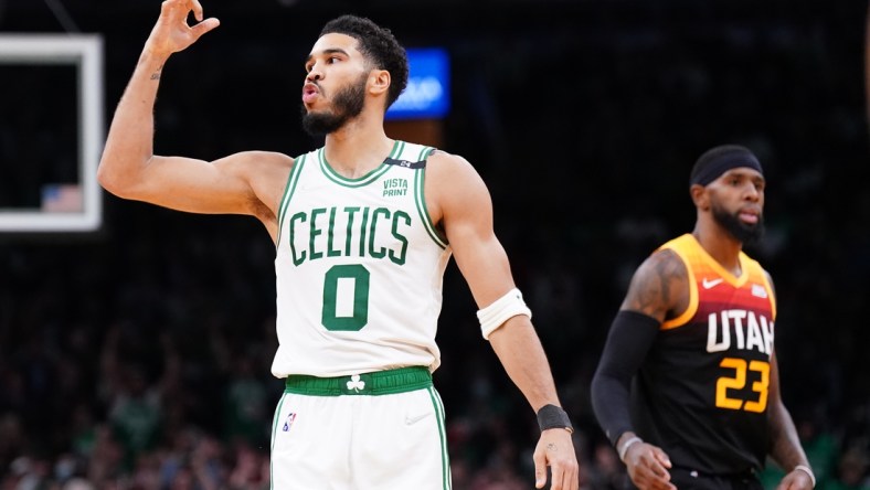 Mar 23, 2022; Boston, Massachusetts, USA; Boston Celtics forward Jayson Tatum (0) reacts after his basket against the Utah Jazz in the second quarter at TD Garden. Mandatory Credit: David Butler II-USA TODAY Sports