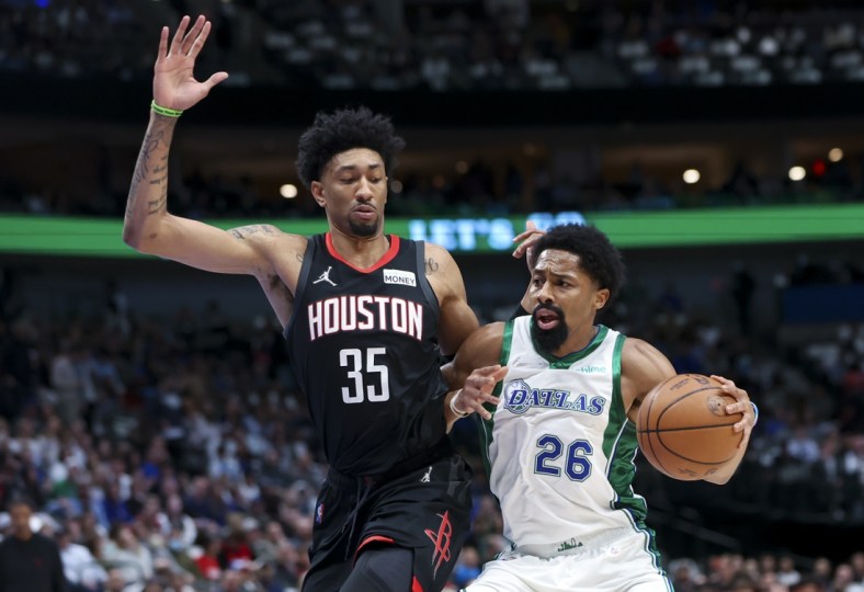 Mar 23, 2022; Dallas, Texas, USA;  Dallas Mavericks guard Spencer Dinwiddie (26) drives to the basket as Houston Rockets center Christian Wood (35) defends during the first quarter at American Airlines Center. Mandatory Credit: Kevin Jairaj-USA TODAY Sports