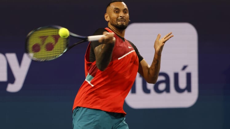 Mar 23, 2022; Miami Gardens, FL, USA; Nick Kyrgios (AUS) hits a forehand against Adrian Mannarino (FRA) (not pictured) in a first round men's singles match in the Miami Open at Hard Rock Stadium. Mandatory Credit: Geoff Burke-USA TODAY Sports