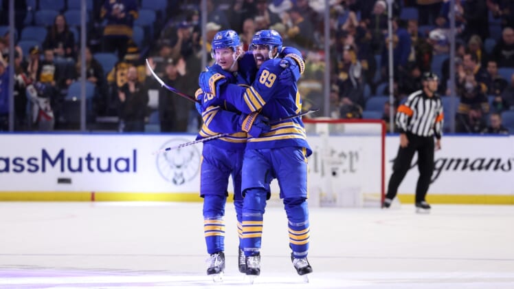 Mar 23, 2022; Buffalo, New York, USA;  Buffalo Sabres right wing Alex Tuch (89) celebrates his game winning shootout goal with defenseman Rasmus Dahlin (26) against the Pittsburgh Penguins at KeyBank Center. Mandatory Credit: Timothy T. Ludwig-USA TODAY Sports