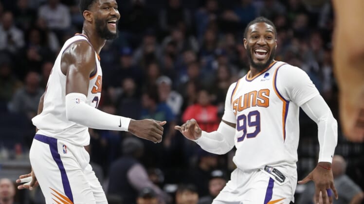 Mar 23, 2022; Minneapolis, Minnesota, USA; Phoenix Suns center Deandre Ayton (22) celebrates with forward Jae Crowder (99) after making a three point basket against the Minnesota Timberwolves to set his personal best for points in a game at Target Center. Mandatory Credit: Bruce Kluckhohn-USA TODAY Sports