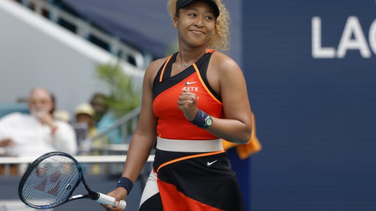 Mar 24, 2022; Miami Gardens, FL, USA; Naomi Osaka (JPN) reacts after match point against Angelique Kerber (GER) (not pictured) in a second round women's singles match in the Miami Open at Hard Rock Stadium. Mandatory Credit: Geoff Burke-USA TODAY Sports