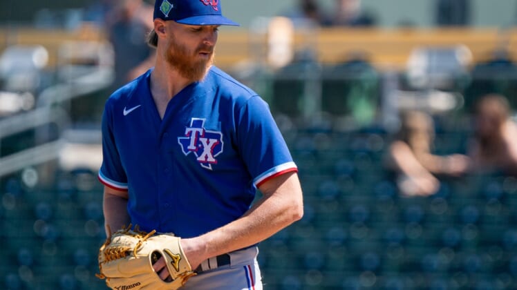 Mar 24, 2022; Mesa, Arizona, USA; Texas Rangers pitcher Jon Gray (22) on the mound in the first inning during a spring training game against the Oakland Athletics at Hohokam Stadium. Mandatory Credit: Allan Henry-USA TODAY Sports