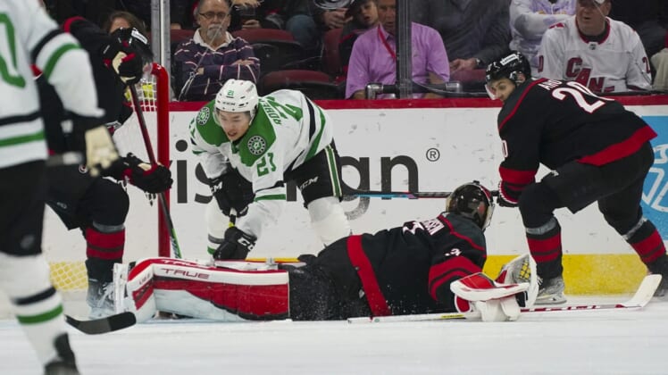 Mar 24, 2022; Raleigh, North Carolina, USA;  Carolina Hurricanes goaltender Frederik Andersen (31) stops the shot by Dallas Stars left wing Jason Robertson (21) during the first period at PNC Arena. Mandatory Credit: James Guillory-USA TODAY Sports