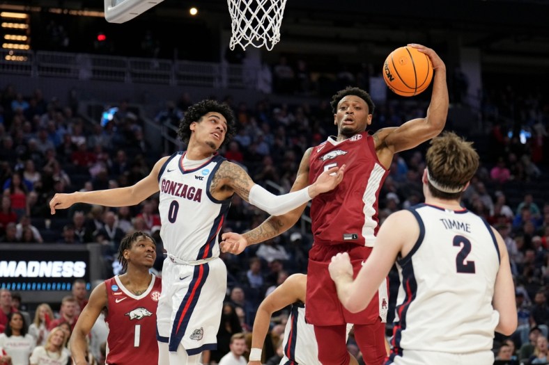 Mar 24, 2022; San Francisco, CA, USA; Arkansas Razorbacks guard Au'Diese Toney (5) grabs a rebound against Gonzaga Bulldogs guard Julian Strawther (0) during the first half in the semifinals of the West regional of the men's college basketball NCAA Tournament at Chase Center. Mandatory Credit: Kelley L Cox-USA TODAY Sports