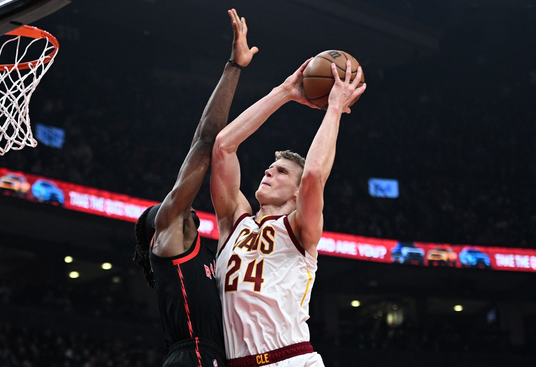 Mar 24, 2022; Toronto, Ontario, CAN;   Cleveland Cavaliers forward Lauri Markkanen (24) shoots for a basket against Toronto Raptors forward Precious Achiuwa (5) in the first half at Scotiabank Arena. Mandatory Credit: Dan Hamilton-USA TODAY Sports