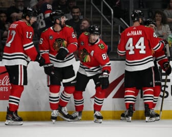 Mar 24, 2022; Los Angeles, California, USA;  Chicago Blackhawks center Dylan Strome (17), defenseman Erik Gustafsson (56), defenseman Calvin de Haan (44) and left wing Alex DeBrincat (12) celebrate after a goal by right wing Patrick Kane (88) in the first period at Crypto.com Arena. Mandatory Credit: Jayne Kamin-Oncea-USA TODAY Sports