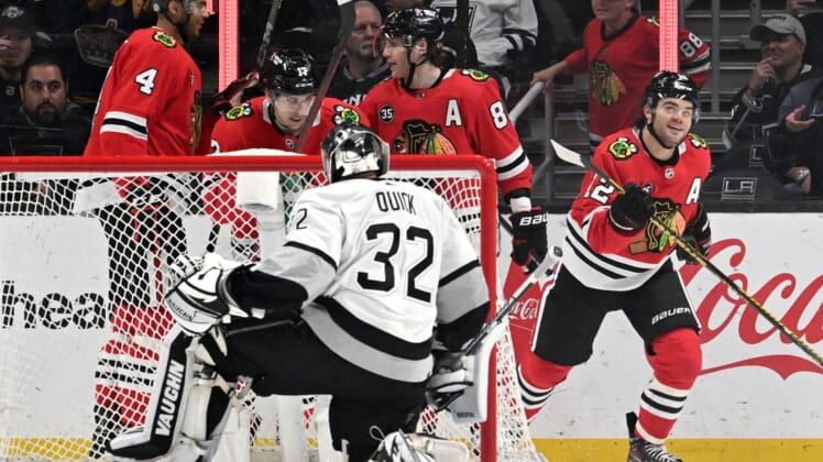 Mar 24, 2022; Los Angeles, California, USA;  The Chicago Blackhawks celebrate after scoring a goal past Los Angeles Kings goaltender Jonathan Quick (32) in the second period at Crypto.com Arena. Mandatory Credit: Jayne Kamin-Oncea-USA TODAY Sports
