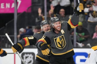 Mar 24, 2022; Las Vegas, Nevada, USA; Vegas Golden Knights right wing Evgenii Dadonov (63) and center Jonathan Marchessault (81) celebrate after Vegas Golden Knights center Jack Eichel (not pictured) scored a goal against the Nashville Predators during the second period at T-Mobile Arena. Mandatory Credit: Stephen R. Sylvanie-USA TODAY Sports