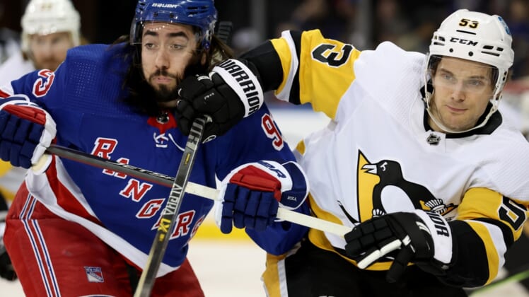Mar 25, 2022; New York, New York, USA; New York Rangers center Mika Zibanejad (93) and Pittsburgh Penguins center Teddy Blueger (53) fight for position during the first period at Madison Square Garden. Mandatory Credit: Brad Penner-USA TODAY Sports