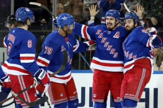 Mar 25, 2022; New York, New York, USA; New York Rangers left wing Chris Kreider (20) celebrates his goal against the Pittsburgh Penguins with defenseman Jacob Trouba (8) and defenseman K'Andre Miller (79) and center Mika Zibanejad (93) during the first period at Madison Square Garden. Mandatory Credit: Brad Penner-USA TODAY Sports