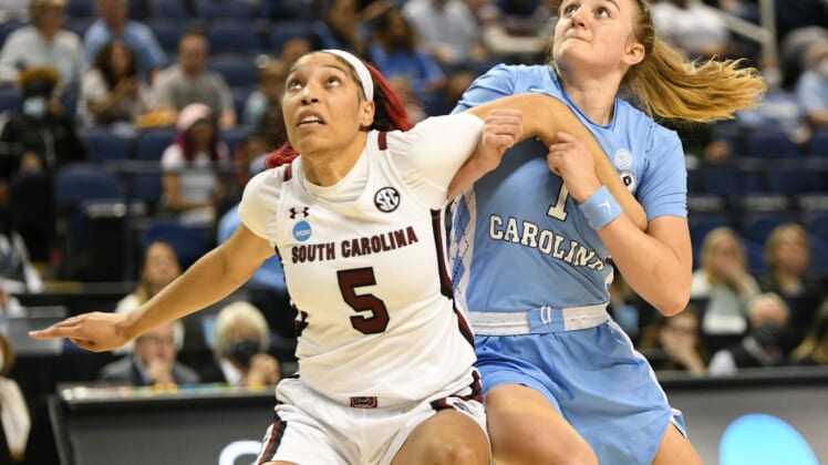 Mar 25, 2022; Greensboro, NC, USA; South Carolina Gamecocks forward Victaria Saxton (5) and North Carolina Tar Heels guard Alyssa Ustby (1) battle for position in the second quarter in the Greensboro regional semifinals of the women's college basketball NCAA Tournament at Greensboro Coliseum. Mandatory Credit: William Howard-USA TODAY Sports