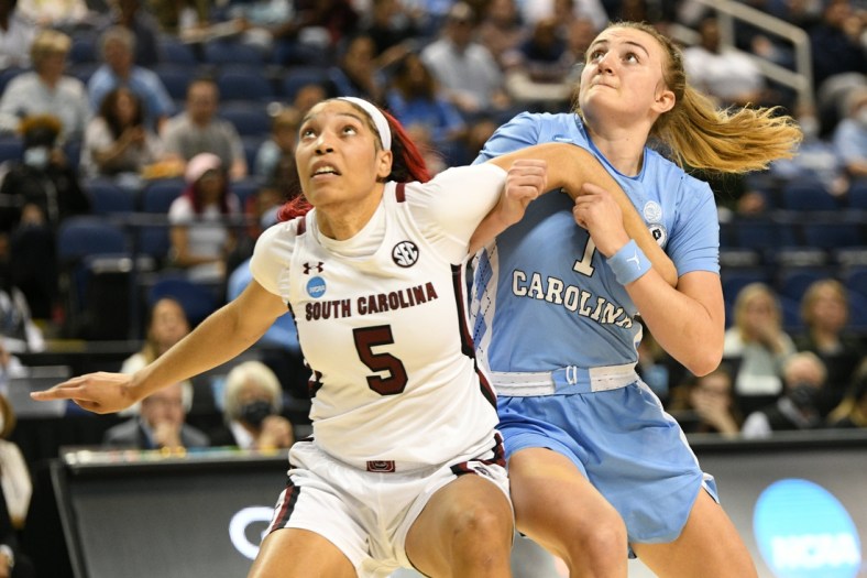 Mar 25, 2022; Greensboro, NC, USA; South Carolina Gamecocks forward Victaria Saxton (5) and North Carolina Tar Heels guard Alyssa Ustby (1) battle for position in the second quarter in the Greensboro regional semifinals of the women's college basketball NCAA Tournament at Greensboro Coliseum. Mandatory Credit: William Howard-USA TODAY Sports