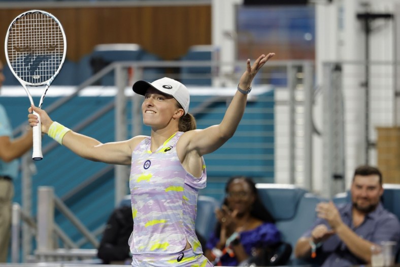 Mar 25, 2022; Miami Gardens, FL, USA; Iga Swiatek (POL) celebrates after her match against Victorija Golubic (SUI) (not pictured) in a second round women's singles match in the Miami Open at Hard Rock Stadium. Mandatory Credit: Geoff Burke-USA TODAY Sports