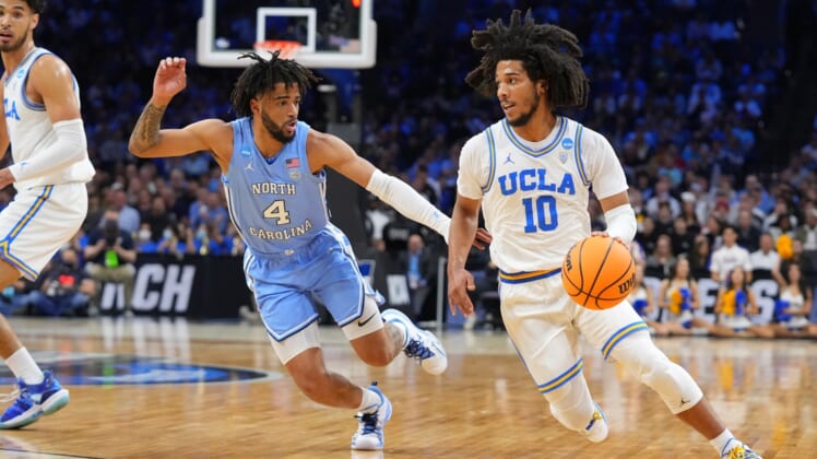 Mar 25, 2022; Philadelphia, PA, USA; UCLA Bruins guard Tyger Campbell (10) controls the ball against North Carolina Tar Heels guard R.J. Davis (4) in the semifinals of the East regional of the men's college basketball NCAA Tournament at Wells Fargo Center. Mandatory Credit: Mitchell Leff-USA TODAY Sports