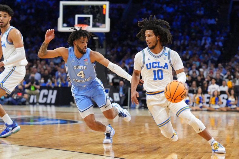 Mar 25, 2022; Philadelphia, PA, USA; UCLA Bruins guard Tyger Campbell (10) controls the ball against North Carolina Tar Heels guard R.J. Davis (4) in the semifinals of the East regional of the men's college basketball NCAA Tournament at Wells Fargo Center. Mandatory Credit: Mitchell Leff-USA TODAY Sports
