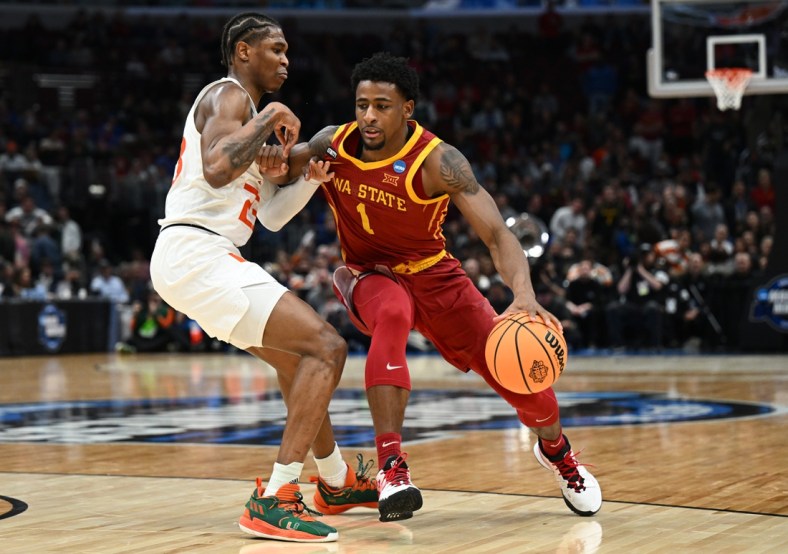 Mar 25, 2022; Chicago, IL, USA; Iowa State Cyclones guard Izaiah Brockington (1) drives against Miami Hurricanes guard Kameron McGusty (23) during the second half in the semifinals of the Midwest regional of the men's college basketball NCAA Tournament at United Center. Mandatory Credit: Jamie Sabau-USA TODAY Sports