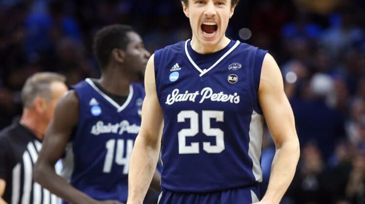 Mar 25, 2022; Philadelphia, PA, USA; Saint Peter's Doug Edert reacts late in the second half of the Peacocks' 67-64 win to advance to the Elite Eight in the NCAA tournament at the Wells Fargo Center in Philadelphia, March 25, 2022. Mandatory Credit: William Bretzger-USA TODAY NETWORK