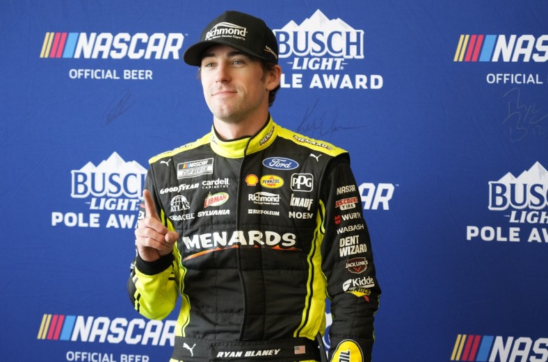Mar 26, 2022; Austin, Texas, USA; NASCAR Cup Series driver Ryan Blaney (12) poses for photos after winning the pole award during the EchoPark Automotive Texas Grand Prix Qualifying at Circuit of the Americas. Mandatory Credit: Mike Dinovo-USA TODAY Sports