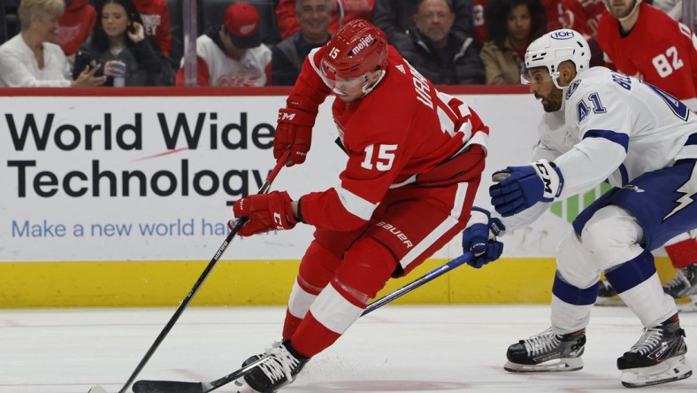 Mar 26, 2022; Detroit, Michigan, USA;  Detroit Red Wings left wing Jakub Vrana (15) skates with the puck chased by Tampa Bay Lightning left wing Pierre-Edouard Bellemare (41) in the first period at Little Caesars Arena. Mandatory Credit: Rick Osentoski-USA TODAY Sports