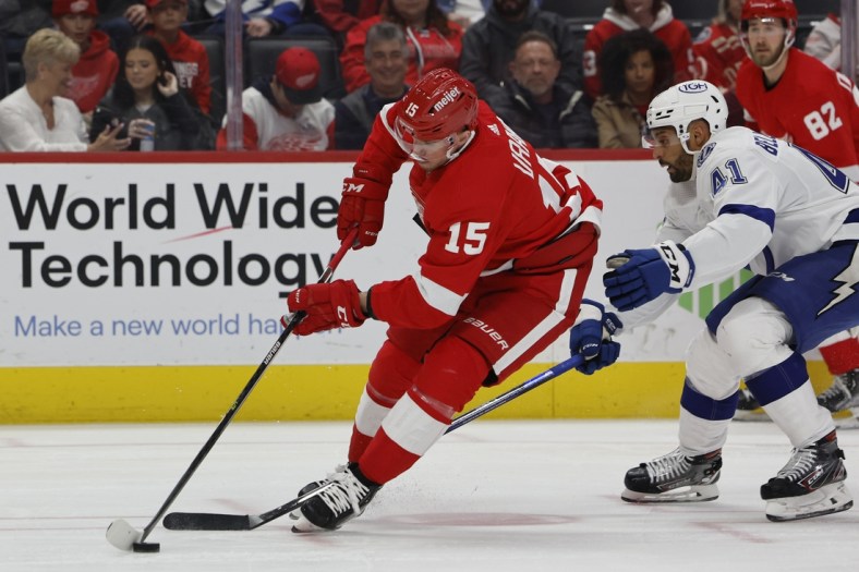 Mar 26, 2022; Detroit, Michigan, USA;  Detroit Red Wings left wing Jakub Vrana (15) skates with the puck chased by Tampa Bay Lightning left wing Pierre-Edouard Bellemare (41) in the first period at Little Caesars Arena. Mandatory Credit: Rick Osentoski-USA TODAY Sports