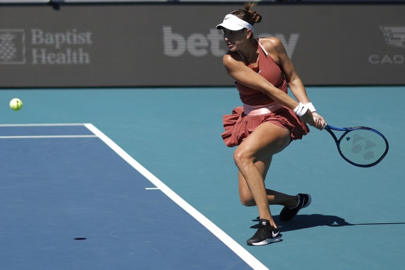 Mar 26, 2022; Miami Gardens, FL, USA; Belinda Bencic (SUI) hits a backhand against Heather Watson (GBR) (not pictured) in a women's singles third round match in the Miami Open at Hard Rock Stadium. Mandatory Credit: Geoff Burke-USA TODAY Sports