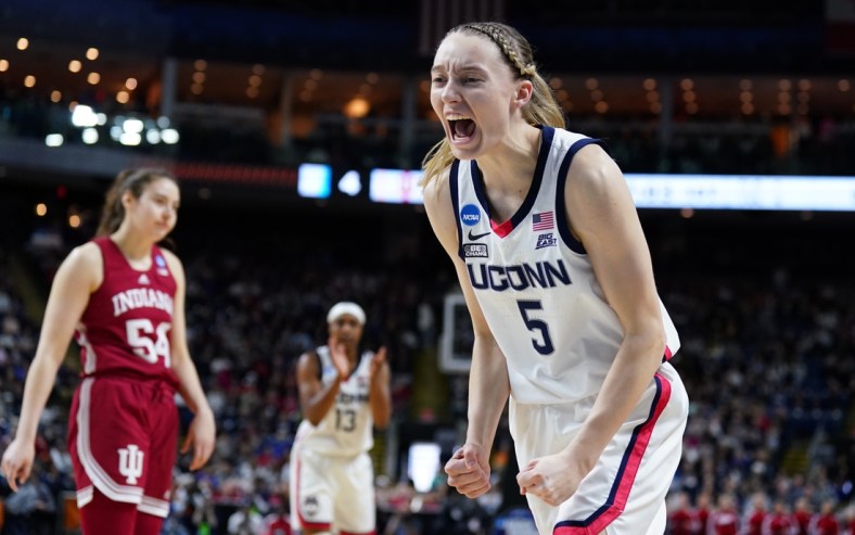 Mar 26, 2022; Bridgeport, CT, USA; UConn Huskies guard Paige Bueckers (5) reacts after a play against the Indiana Hoosiers during the first half in the Bridgeport regional semifinals of the women's college basketball NCAA Tournament at Webster Bank Arena. Mandatory Credit: David Butler II-USA TODAY Sports