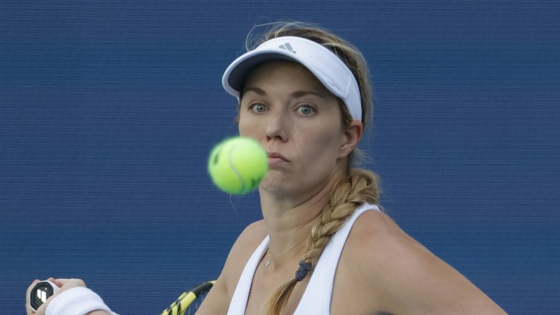 Mar 26, 2022; Miami Gardens, FL, USA; Danielle Collins (USA) follows the ball while hitting a forehand against Vera Zvonareva (not pictured) in a third round women's singles match in the Miami Open at Hard Rock Stadium. Mandatory Credit: Geoff Burke-USA TODAY Sports