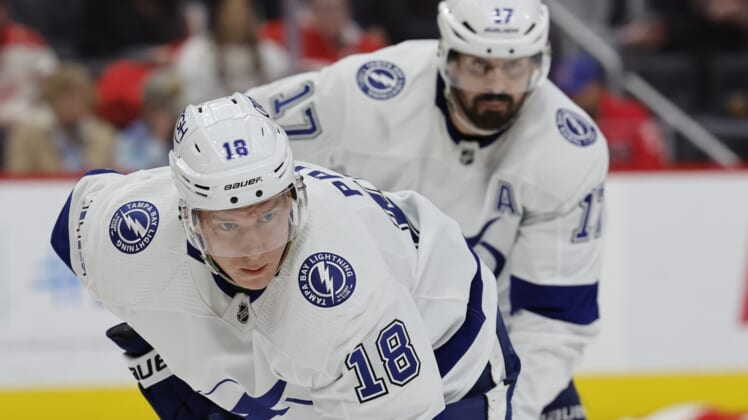 Mar 26, 2022; Detroit, Michigan, USA;  Tampa Bay Lightning left wing Ondrej Palat (18) and left wing Alex Killorn (17) gets set during a face off in the third period against the Detroit Red Wings at Little Caesars Arena. Mandatory Credit: Rick Osentoski-USA TODAY Sports
