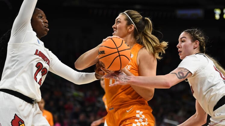 Tennessee forward Karoline Striplin (11) tried to get to the basket while guarded by Louisville forwards Liz Dixon (22) and Emily Engstler (21) during the NCAA tournament Sweet 16 basketball game on Saturday, March 26, 2022. in Wichita, KS.Lady Vols Louisville Ncaa