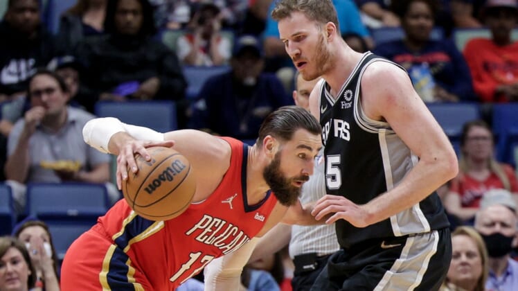 Mar 26, 2022; New Orleans, Louisiana, USA;  New Orleans Pelicans center Jonas Valanciunas (17) controls the ball against San Antonio Spurs center Jakob Poeltl (25) during the first half at the New Orleans Pelicans at the Smoothie King Center. Mandatory Credit: Stephen Lew-USA TODAY Sports