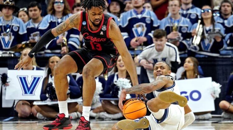 Mar 26, 2022; San Antonio, TX, USA; Villanova Wildcats guard Justin Moore (5) and Houston Cougars forward J'Wan Roberts (13) go for the ball during the second half in the finals of the South regional of the men's college basketball NCAA Tournament at AT&T Center. Mandatory Credit: Scott Wachter-USA TODAY Sports