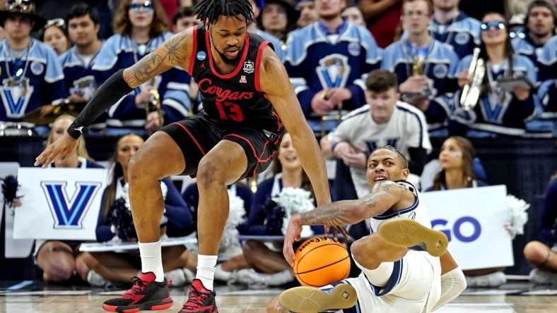 Mar 26, 2022; San Antonio, TX, USA; Villanova Wildcats guard Justin Moore (5) and Houston Cougars forward J'Wan Roberts (13) go for the ball during the second half in the finals of the South regional of the men's college basketball NCAA Tournament at AT&T Center. Mandatory Credit: Scott Wachter-USA TODAY Sports