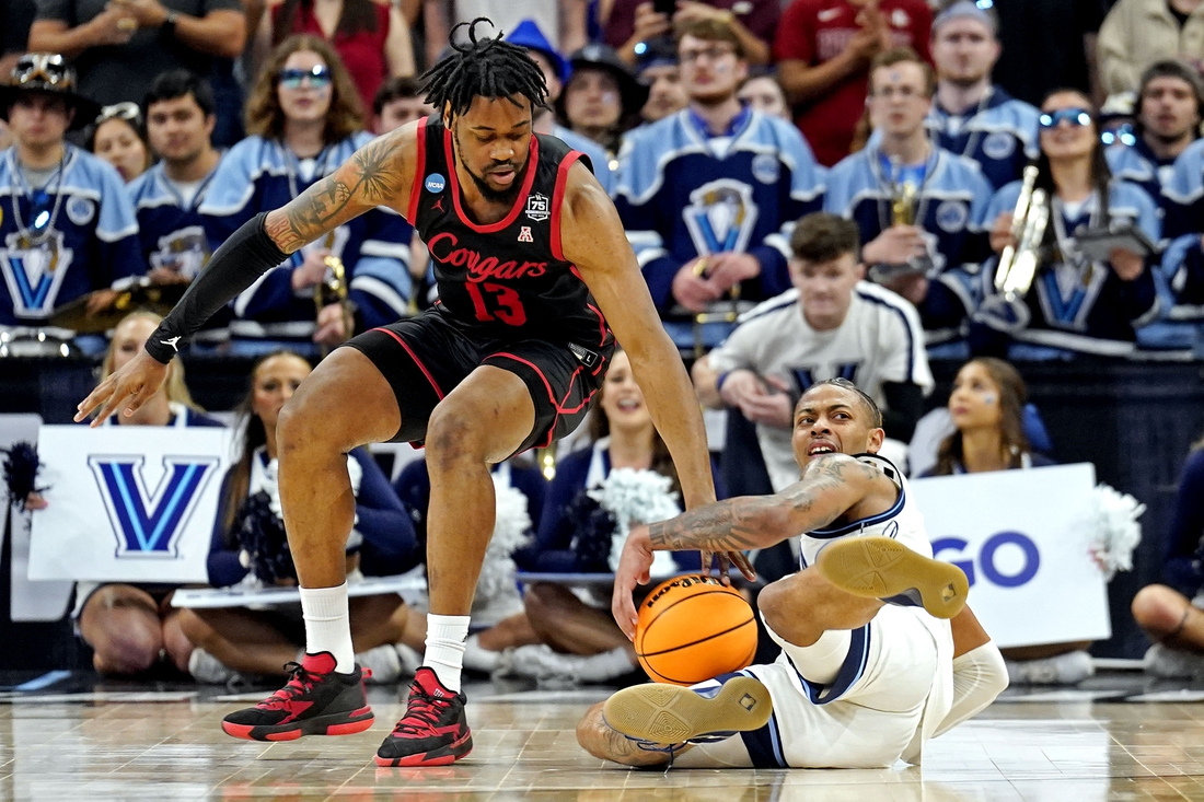 Mar 26, 2022; San Antonio, TX, USA; Villanova Wildcats guard Justin Moore (5) and Houston Cougars forward J'Wan Roberts (13) go for the ball during the second half in the finals of the South regional of the men's college basketball NCAA Tournament at AT&T Center. Mandatory Credit: Scott Wachter-USA TODAY Sports