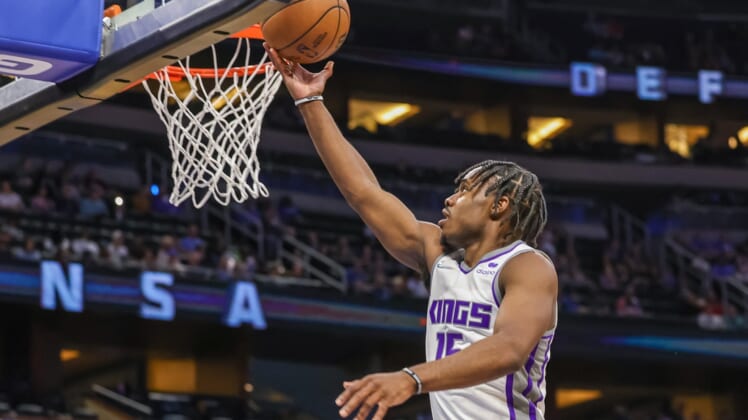 Mar 26, 2022; Orlando, Florida, USA; Sacramento Kings guard Davion Mitchell (15) goes to the basket during the second quarter against the Orlando Magic at Amway Center. Mandatory Credit: Mike Watters-USA TODAY Sports