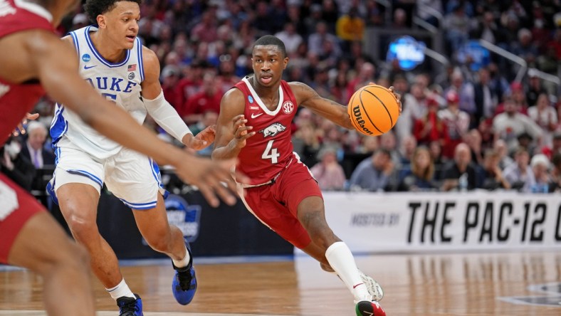 Mar 26, 2022; San Francisco, CA, USA; Arkansas Razorbacks guard Davonte Davis (4) dribbles the ball against Duke Blue Devils forward Paolo Banchero (5) during the first half in the finals of the West regional of the men's college basketball NCAA Tournament at Chase Center. Mandatory Credit: Kelley L Cox-USA TODAY Sports