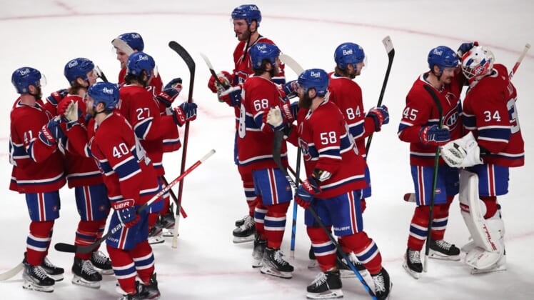 Mar 26, 2022; Montreal, Quebec, CAN; Montreal Canadiens players celebrate after defeating the Toronto Maple Leafs at Bell Centre. Mandatory Credit: Jean-Yves Ahern-USA TODAY Sports