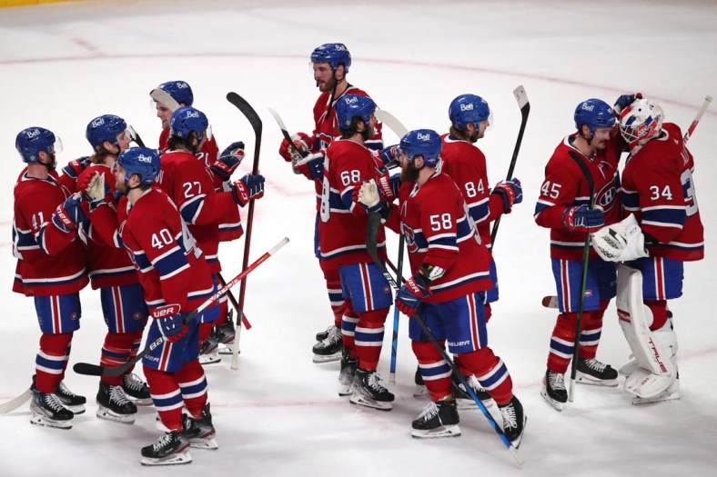 Mar 26, 2022; Montreal, Quebec, CAN; Montreal Canadiens players celebrate after defeating the Toronto Maple Leafs at Bell Centre. Mandatory Credit: Jean-Yves Ahern-USA TODAY Sports