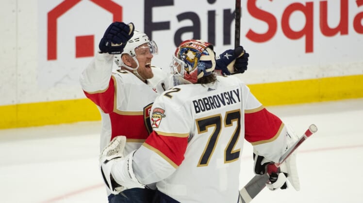 Mar 26, 2021; Ottawa, Ontario, CAN; Florida Panthers right wing Patric Hornqvist (70) celebrates with goalie Sergei Bobrovsky (72) after defeating the Ottawa Senators at the Canadian Tire Centre. Mandatory Credit: Marc DesRosiers-USA TODAY Sports