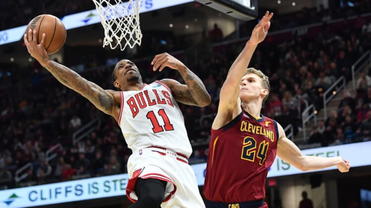 Mar 26, 2022; Cleveland, Ohio, USA; Chicago Bulls forward DeMar DeRozan (11) drives to the basket against Cleveland Cavaliers forward Lauri Markkanen (24) during the second half at Rocket Mortgage FieldHouse. Mandatory Credit: Ken Blaze-USA TODAY Sports