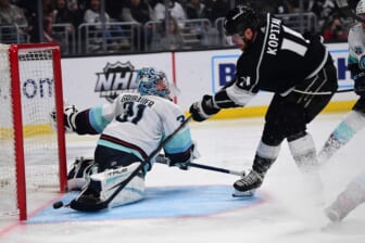 Mar 26, 2022; Los Angeles, California, USA; Los Angeles Kings center Anze Kopitar (11) scores a goal against Seattle Kraken goaltender Philipp Grubauer (31) during the second period at Crypto.com Arena. Mandatory Credit: Gary A. Vasquez-USA TODAY Sports
