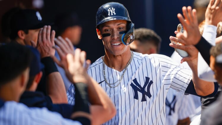 Mar 27, 2022; Tampa, Florida, USA; New York Yankees right fielder Aaron Judge (99) is congratulated after hitting a home run in the third inning against the Pittsburgh Pirates during spring training at George M. Steinbrenner Field. Mandatory Credit: Nathan Ray Seebeck-USA TODAY Sports