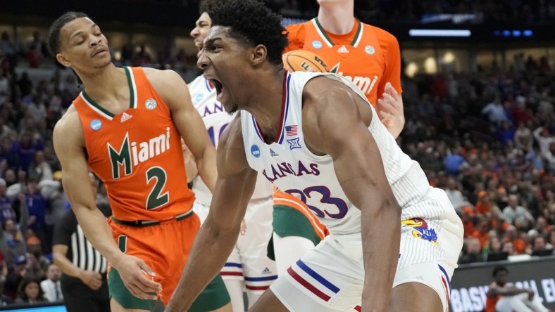 Mar 27, 2022; Chicago, IL, USA; Kansas Jayhawks forward David McCormack (33) reacts after a play during the second half against the Miami Hurricanes in the finals of the Midwest regional of the men's college basketball NCAA Tournament at United Center. Mandatory Credit: David Banks-USA TODAY Sports