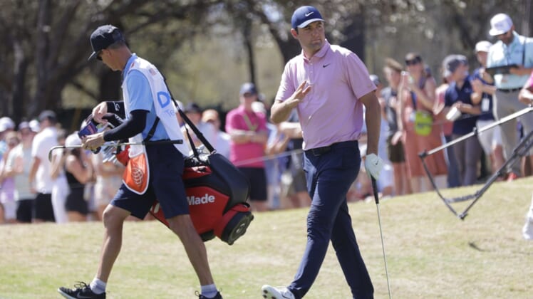 Mar 27, 2022; Austin, Texas, USA; Scottie Scheffler acknowledges his supporters on the 6th hole during the final round of the World Golf Championships-Dell Technologies Match Play golf tournament. Mandatory Credit: Erich Schlegel-USA TODAY Sports