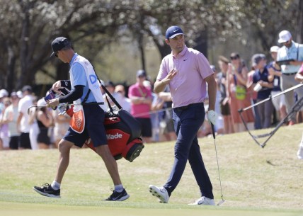 Mar 27, 2022; Austin, Texas, USA; Scottie Scheffler acknowledges his supporters on the 6th hole during the final round of the World Golf Championships-Dell Technologies Match Play golf tournament. Mandatory Credit: Erich Schlegel-USA TODAY Sports