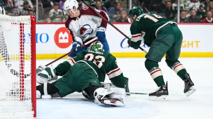 Mar 27, 2022; Saint Paul, Minnesota, USA; Minnesota Wild right wing Ryan Hartman (38) makes a save against Colorado Avalanche right wing Nicolas Aube-Kubel (16) in the first period at Xcel Energy Center. Mandatory Credit: David Berding-USA TODAY Sports