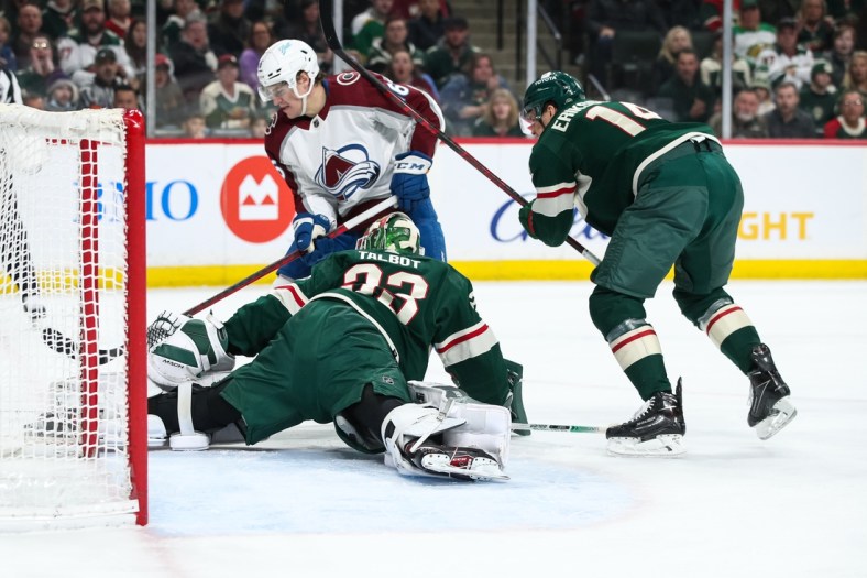 Mar 27, 2022; Saint Paul, Minnesota, USA; Minnesota Wild right wing Ryan Hartman (38) makes a save against Colorado Avalanche right wing Nicolas Aube-Kubel (16) in the first period at Xcel Energy Center. Mandatory Credit: David Berding-USA TODAY Sports