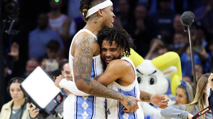 Mar 27, 2022; Philadelphia, PA, USA; North Carolina Tar Heels guard R.J. Davis (4) and forward Armando Bacot (5) celebrate after the Tar Heels defeated the St. Peters Peacocks in the finals of the East regional of the men's college basketball NCAA Tournament at Wells Fargo Center. Mandatory Credit: Bill Streicher-USA TODAY Sports